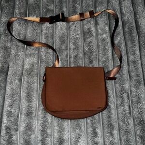 Serra Neoprene Convertible Bag in brown.‎